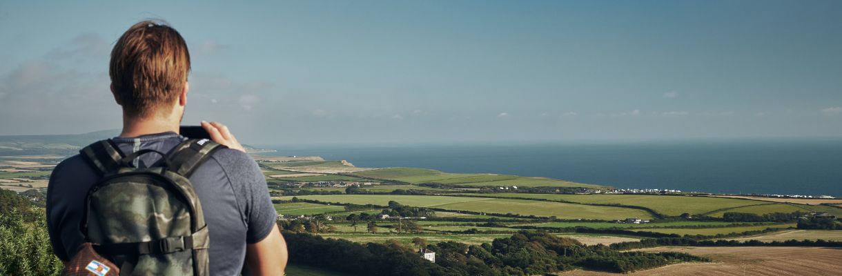 Man taking image of the views over the Isle of Wight